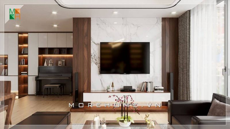 Mẫu thiết kế kệ tivi phong cách hiện đại với vách tường đá kết hợp với khung gỗ óc chó tự nhiên, góp phần tạo nên sự sang trọng, thẩm mỹ cao cấp và tinh tế cho không gian của gia chủ.